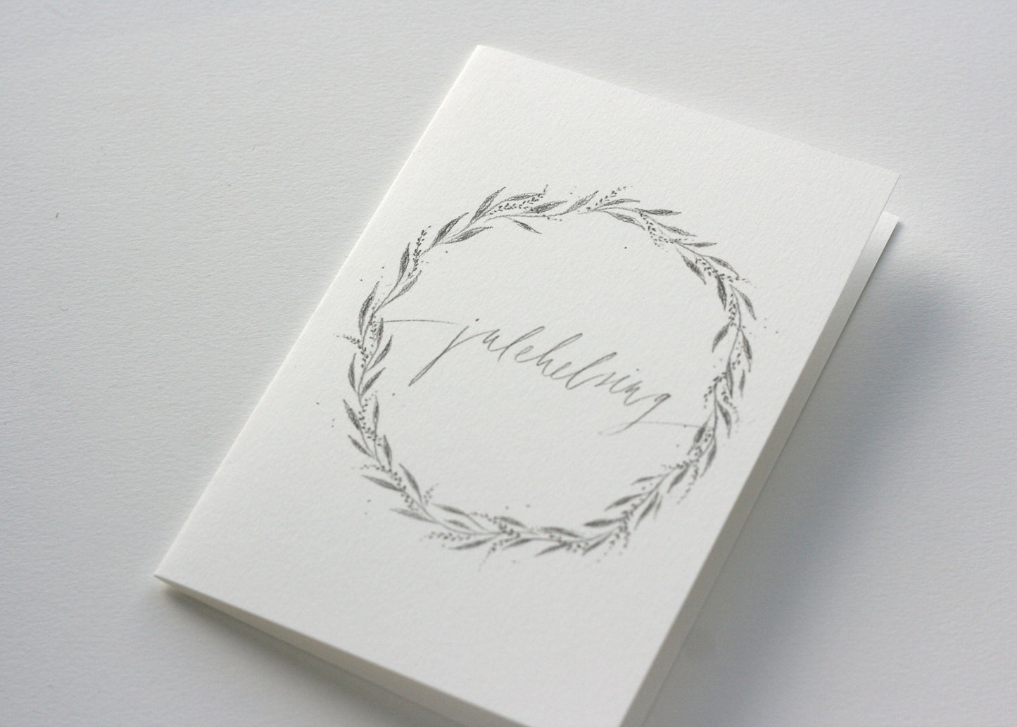 Julekort med krans, julehelsing